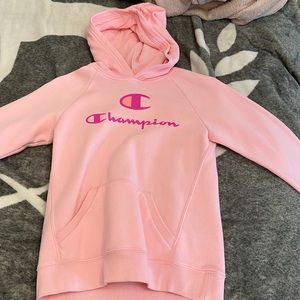 This is a pink, champion hoodie lightly worn.